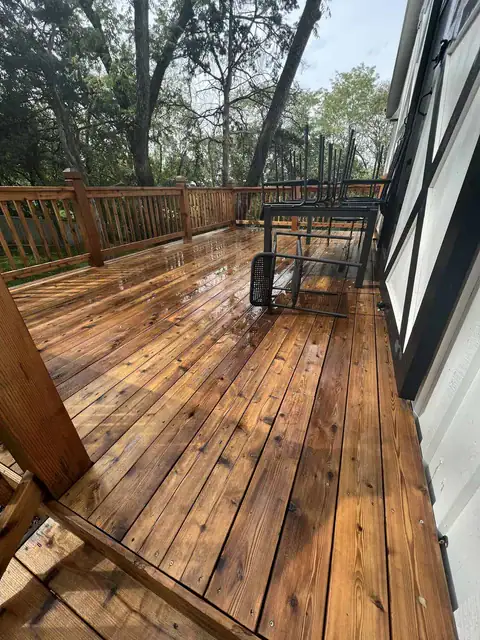 Wood deck after soft washing, brightened to a natural tone