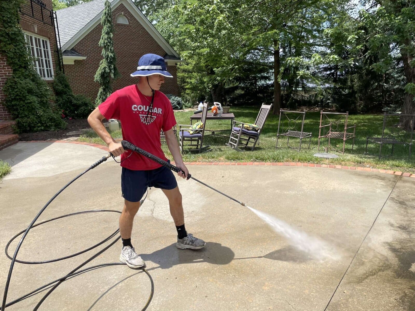 Daniel pressure washing a patio in the early days