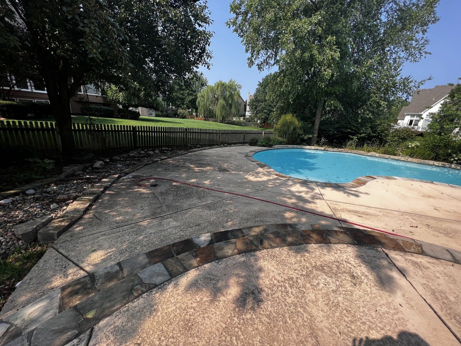 Pool deck before pressure washing — Kansas City metro