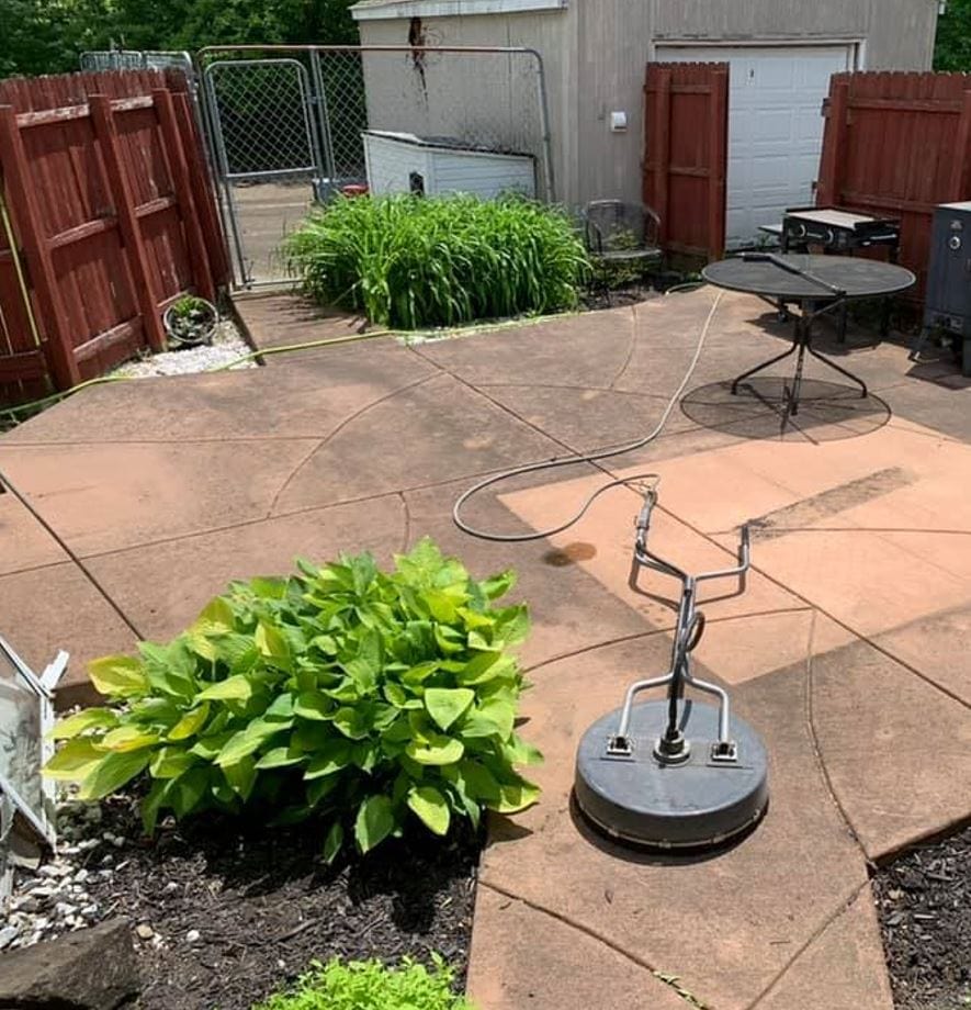Stained concrete patio before cleaning in Parkville, MO