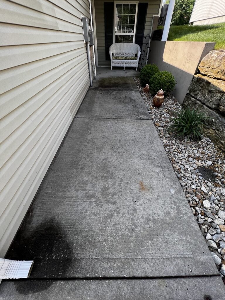 Dirty sidewalk before pressure washing in Gladstone, MO