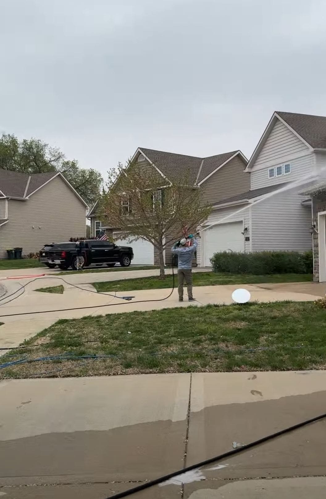 KC Splash crew soft washing Fort Leavenworth military housing exterior — soft wash application on vinyl siding residential buildings Fort Leavenworth Kansas