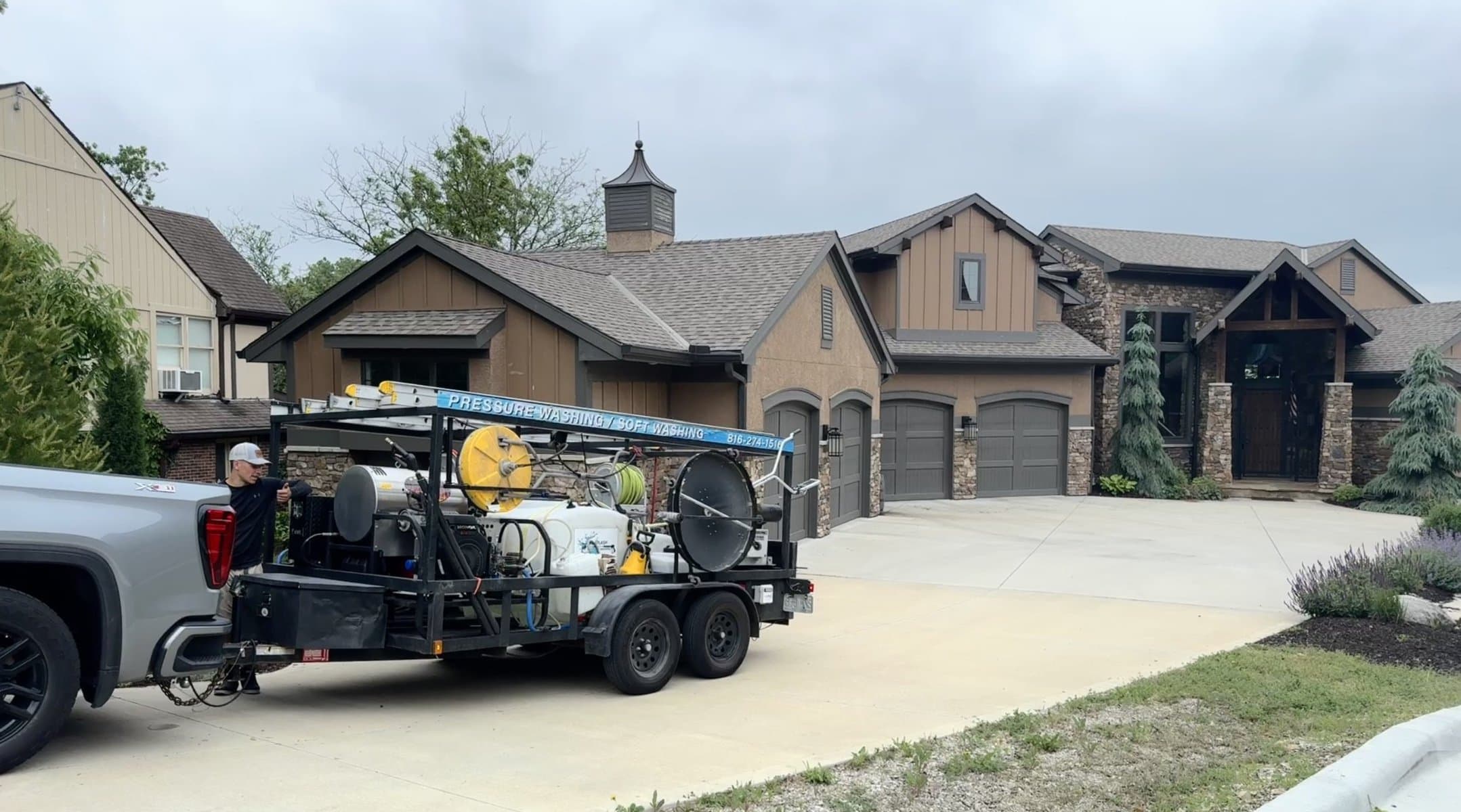 KC Splash soft washing a luxury home in the Weatherby Lake area