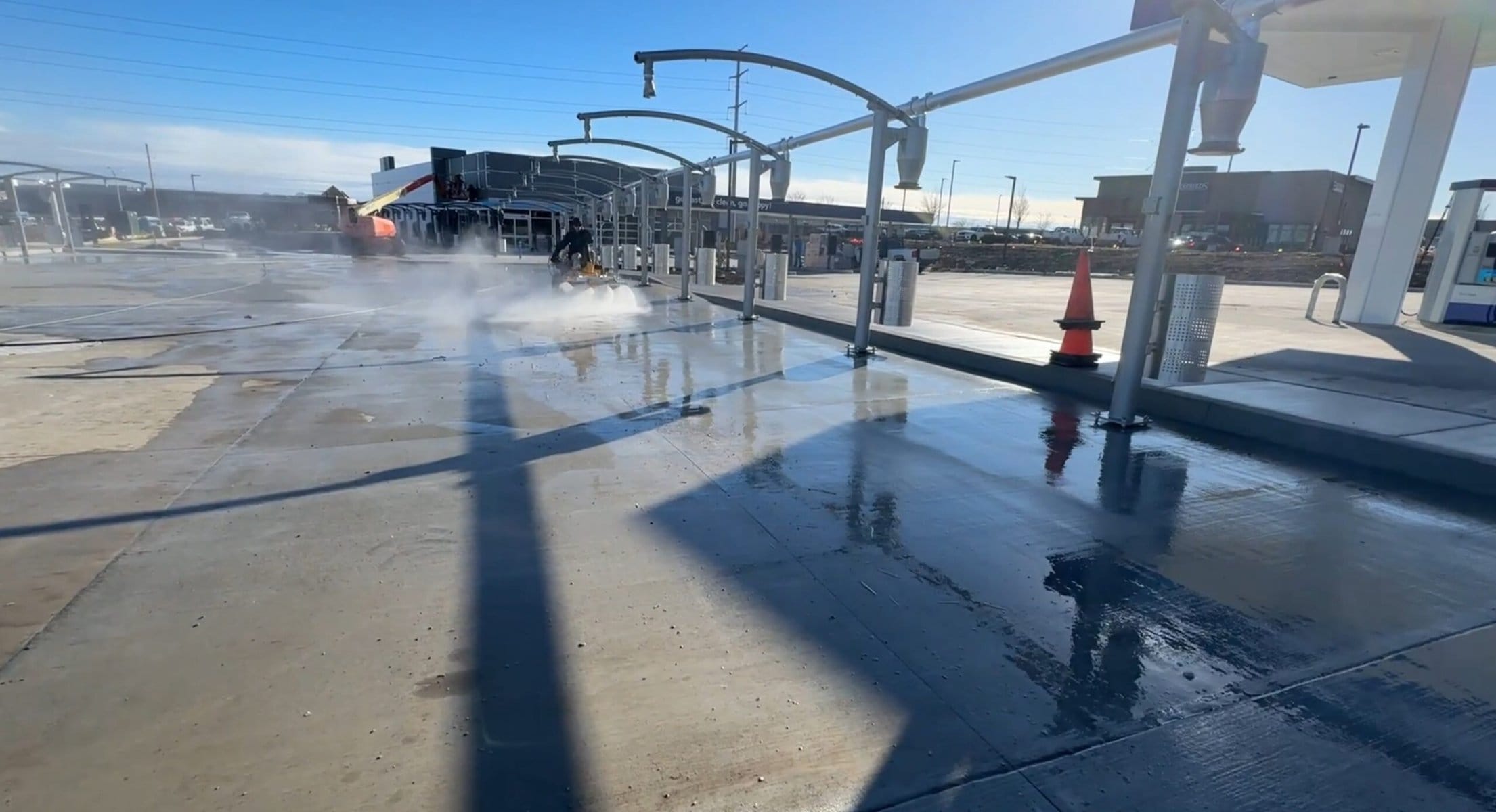 The Beast surface cleaner pressure washing Tidal Wave Auto Spa post-construction lot