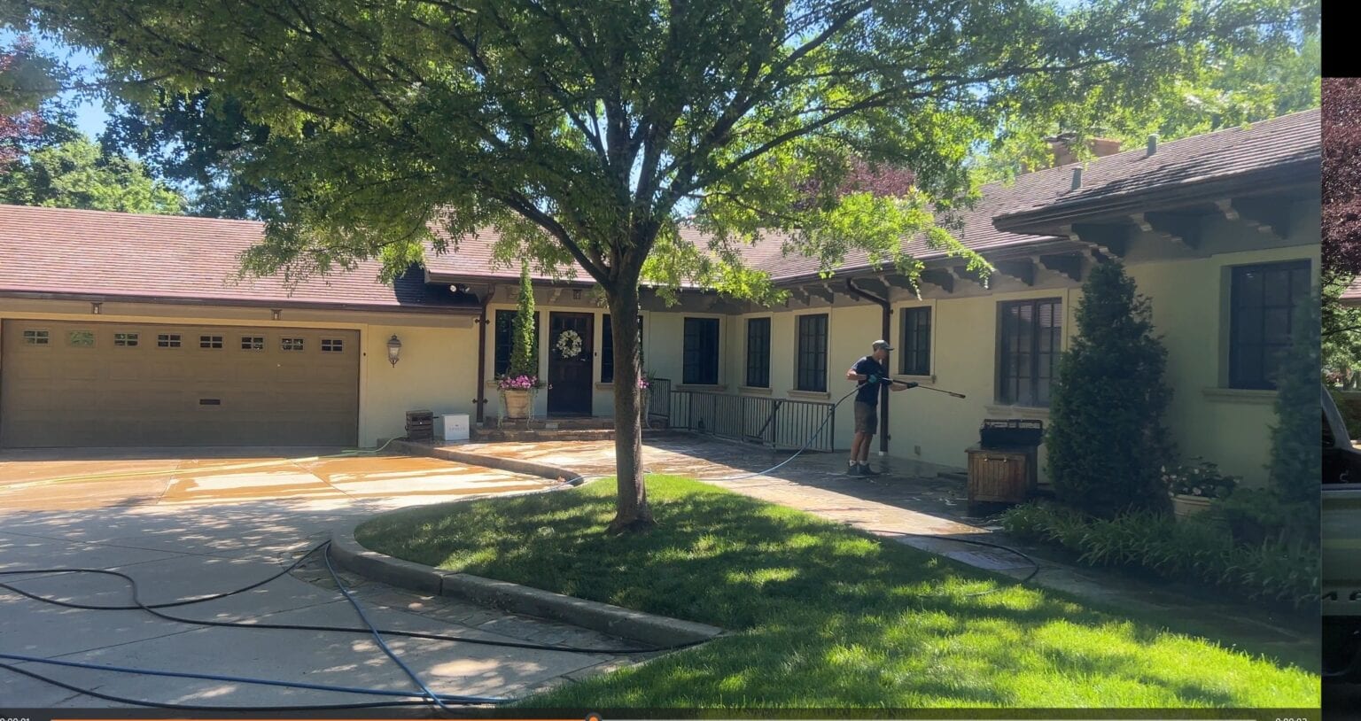 KC Splash washing the circular driveway and front exterior of a traditional estate home in Mission Hills KS