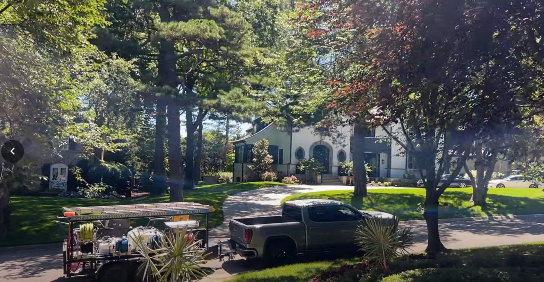 KC Splash pressure washing truck parked at a luxury stucco estate in Mission Hills Kansas City KS