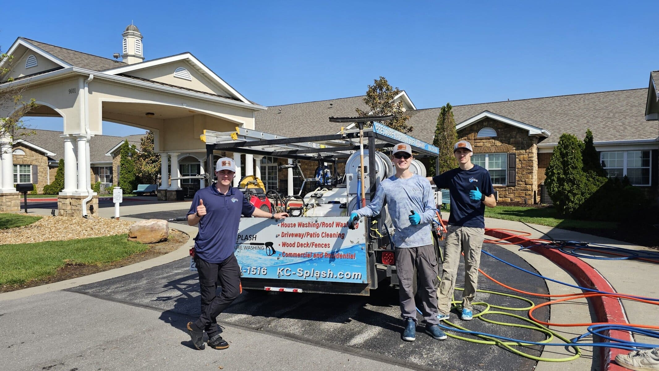 KC Splash three-person crew giving thumbs up in front of branded truck at Addington Place of Shoal Creek Kansas City MO β job complete
