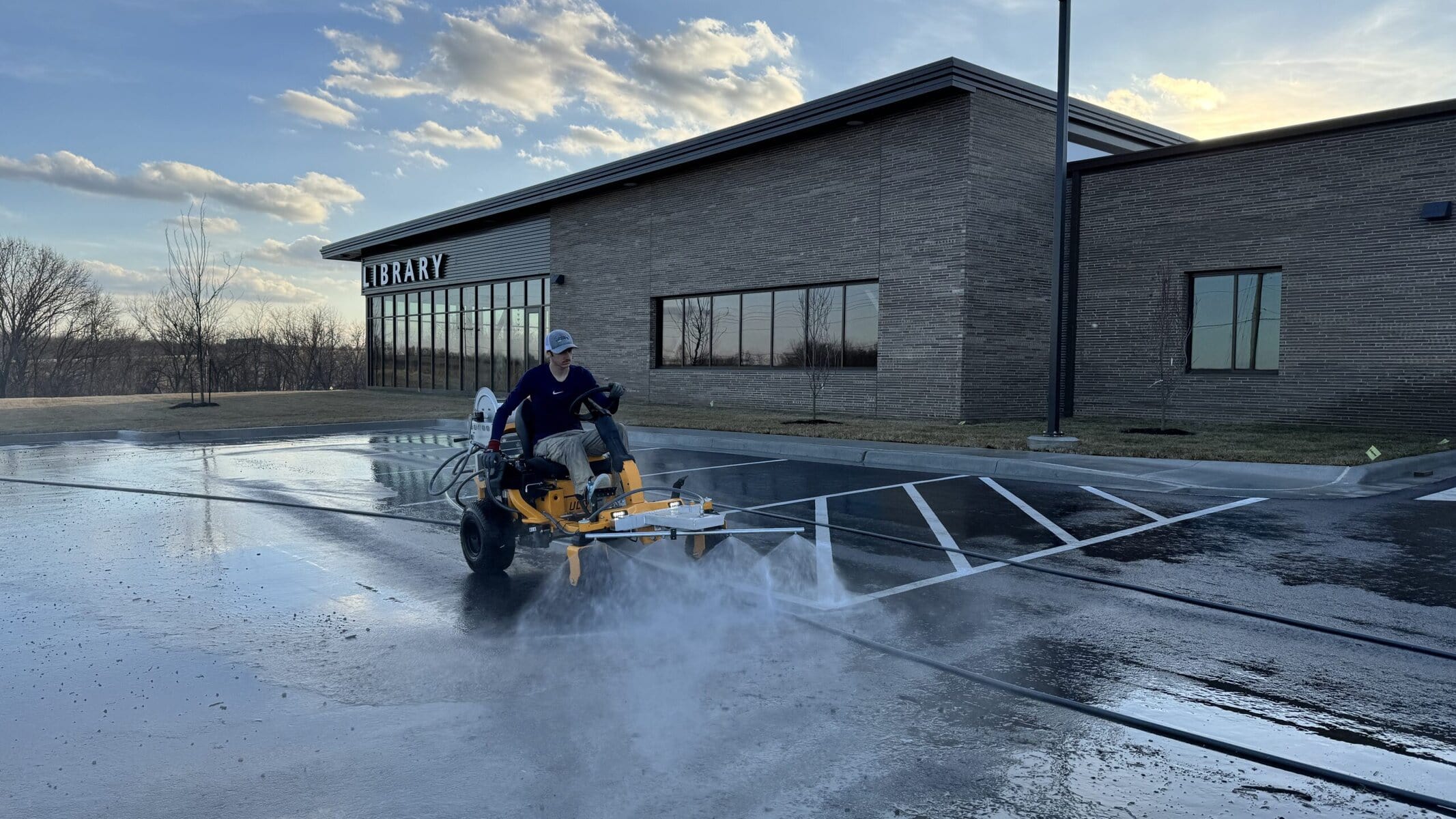 Watch KC Splash clean Rolling Hills Library parking lot post-construction — Beast ride-on surface cleaner St. Joseph MO