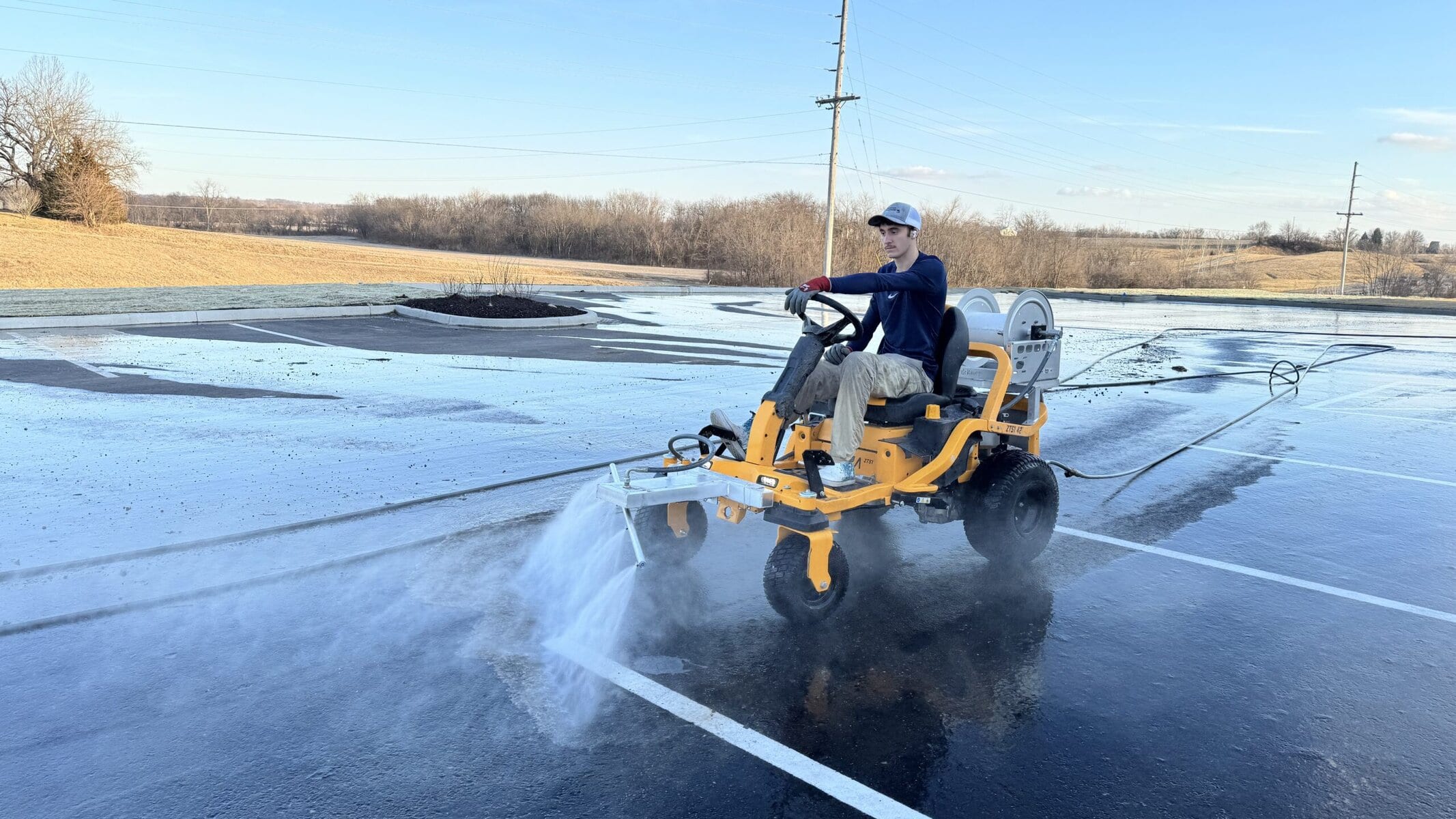 The Beast ride-on surface cleaner working a large parking lot project
