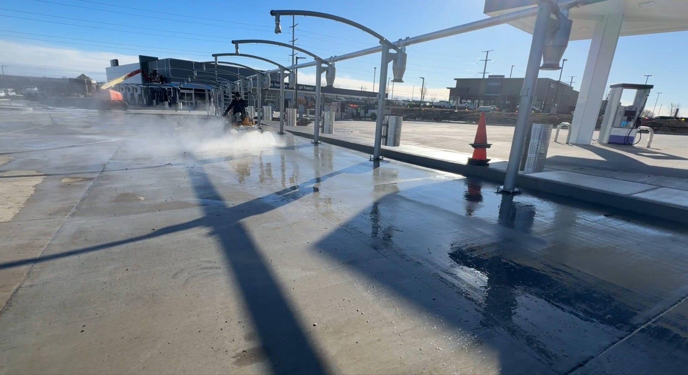 Ground-level wide view under Tidal Wave Auto Spa canopy