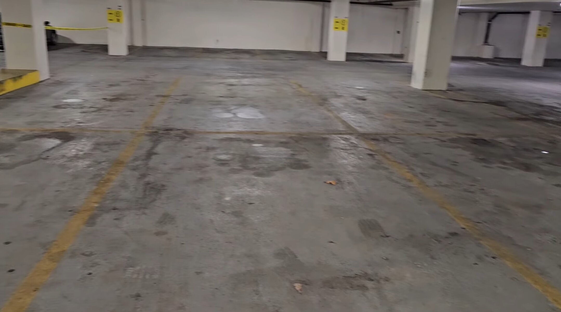 Heavily soiled commercial flatwork concrete before hot water extraction