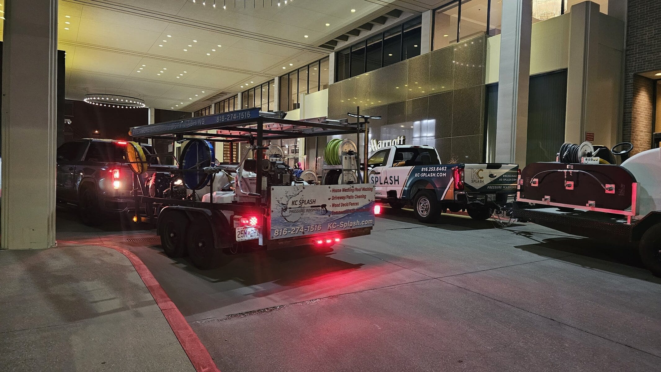 KC Splash crew arriving at Kansas City Marriott Downtown with multiple pressure washing rigs for overnight parking garage cleaning