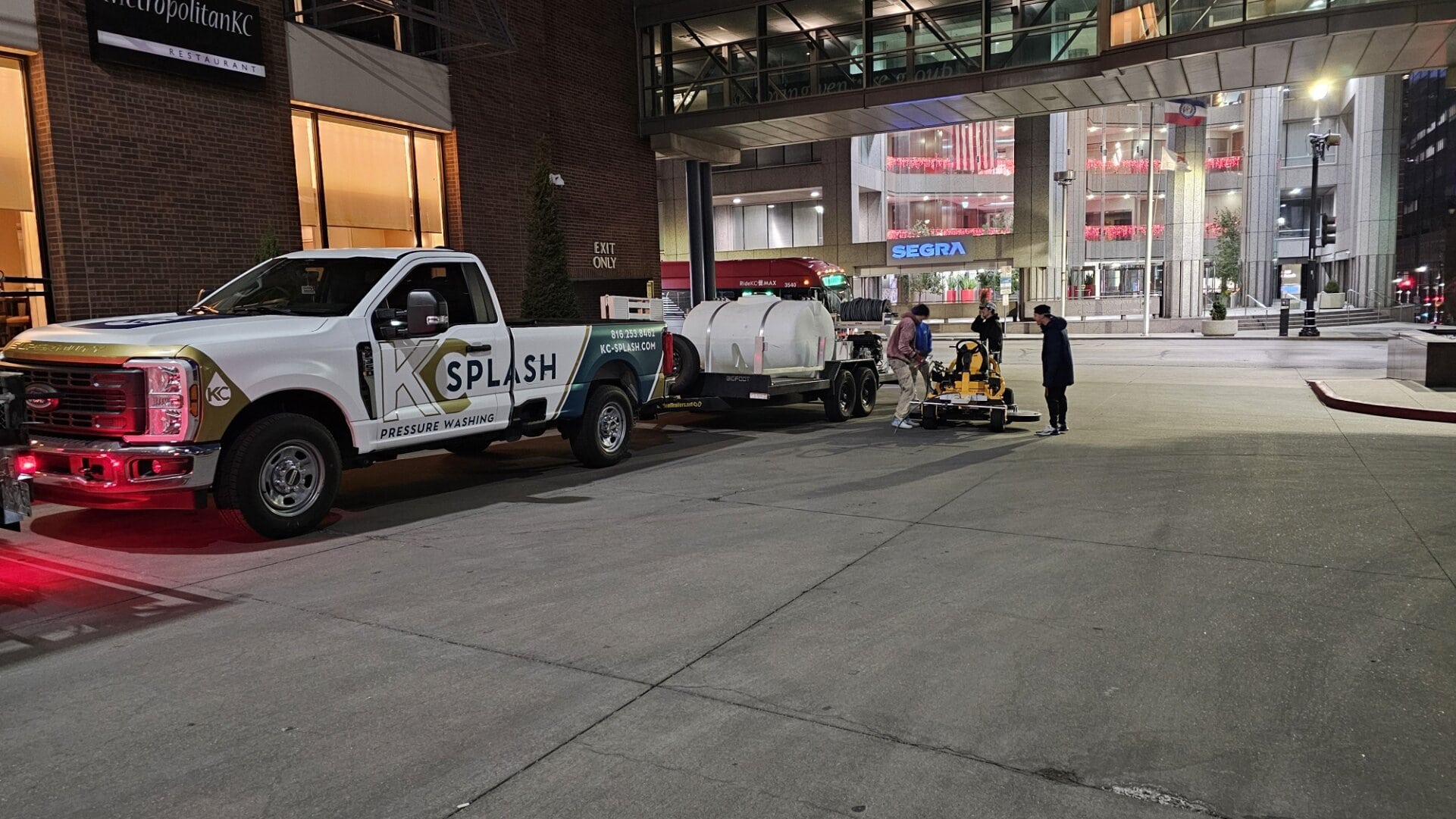 KC Splash pressure washing truck and Bigfoot trailer with ride-on surface cleaner staged at Kansas City Marriott Downtown
