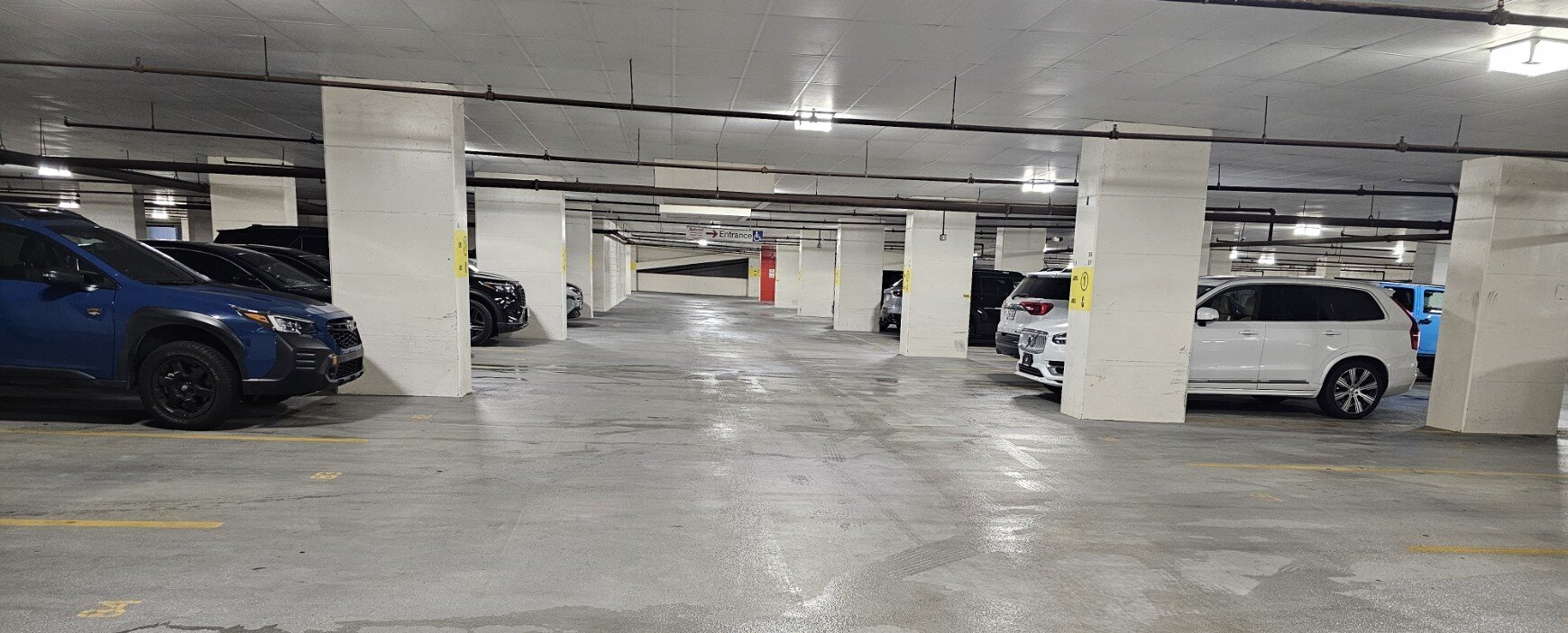 Pristine, light-reflective commercial concrete floor after hot water pressure wash