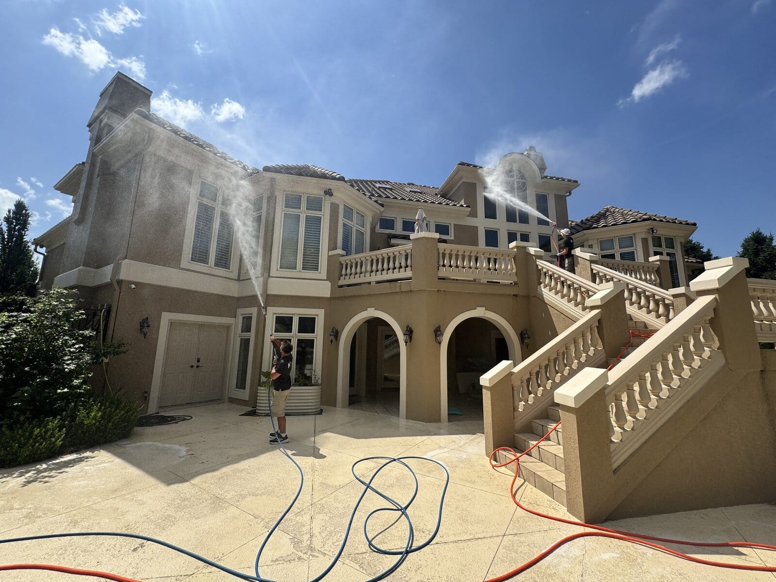 10,000 sq ft luxury stucco estate exterior before KC Splash soft wash in The National, Parkville MO