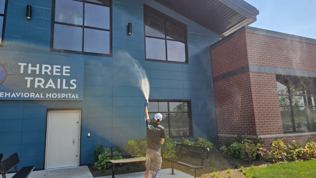 KC Splash soft washing a new building exterior at Three Trails Behavioral Hospital, Kansas City metro