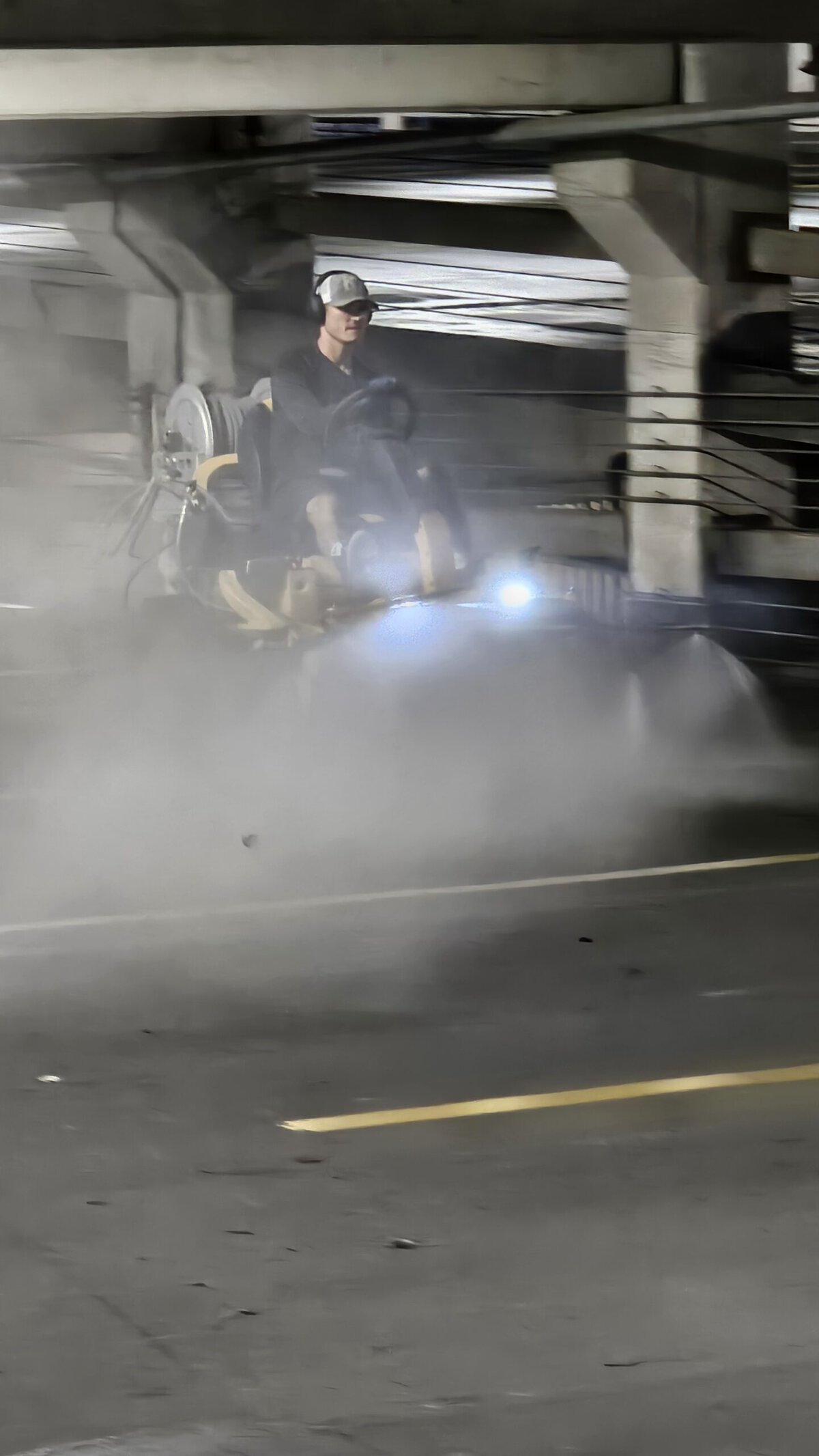 The Beast ride-on surface cleaner running an open deck at Crown Center parking garage Kansas City
