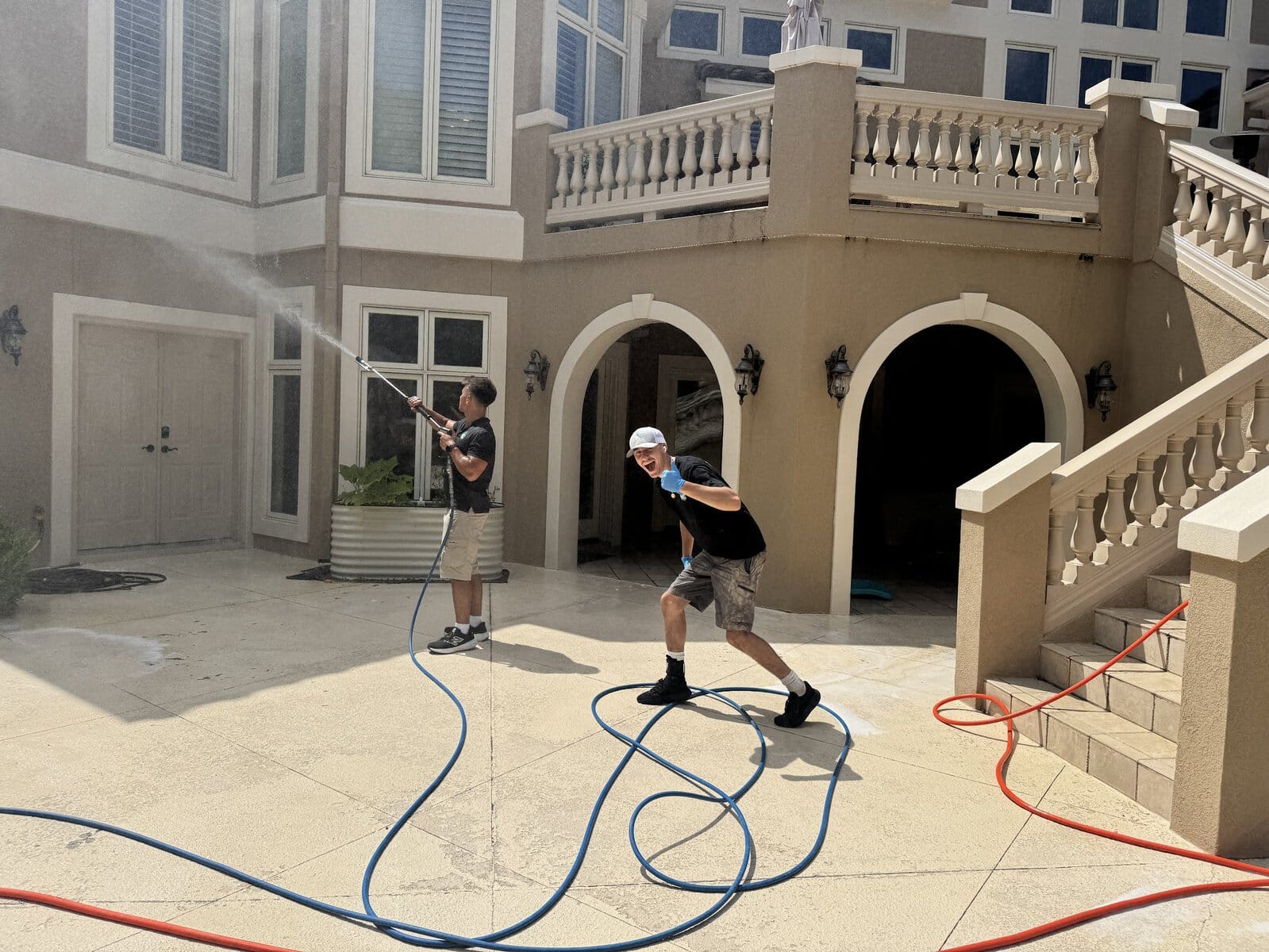 KC Splash crew soft washing a luxury estate exterior in The National Parkville