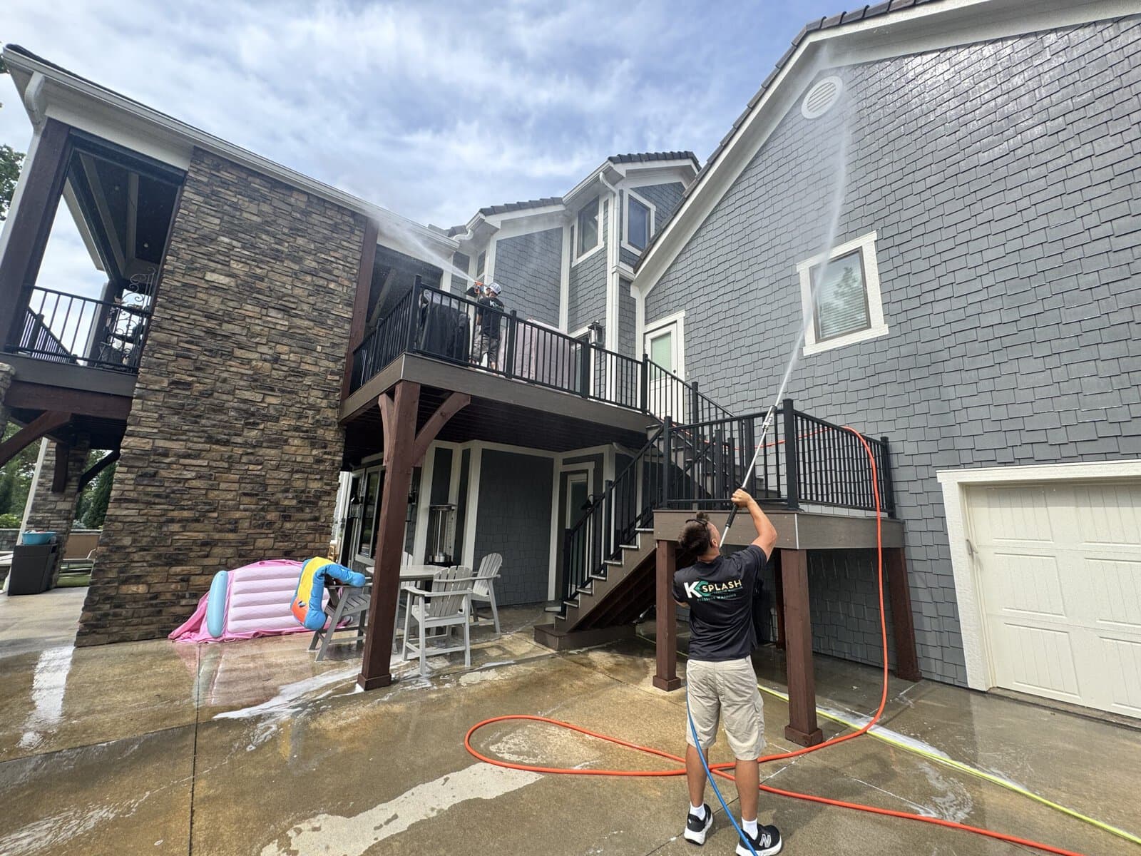 KC Splash crew house washing a two-story shingle-style estate in Kansas City's Northland