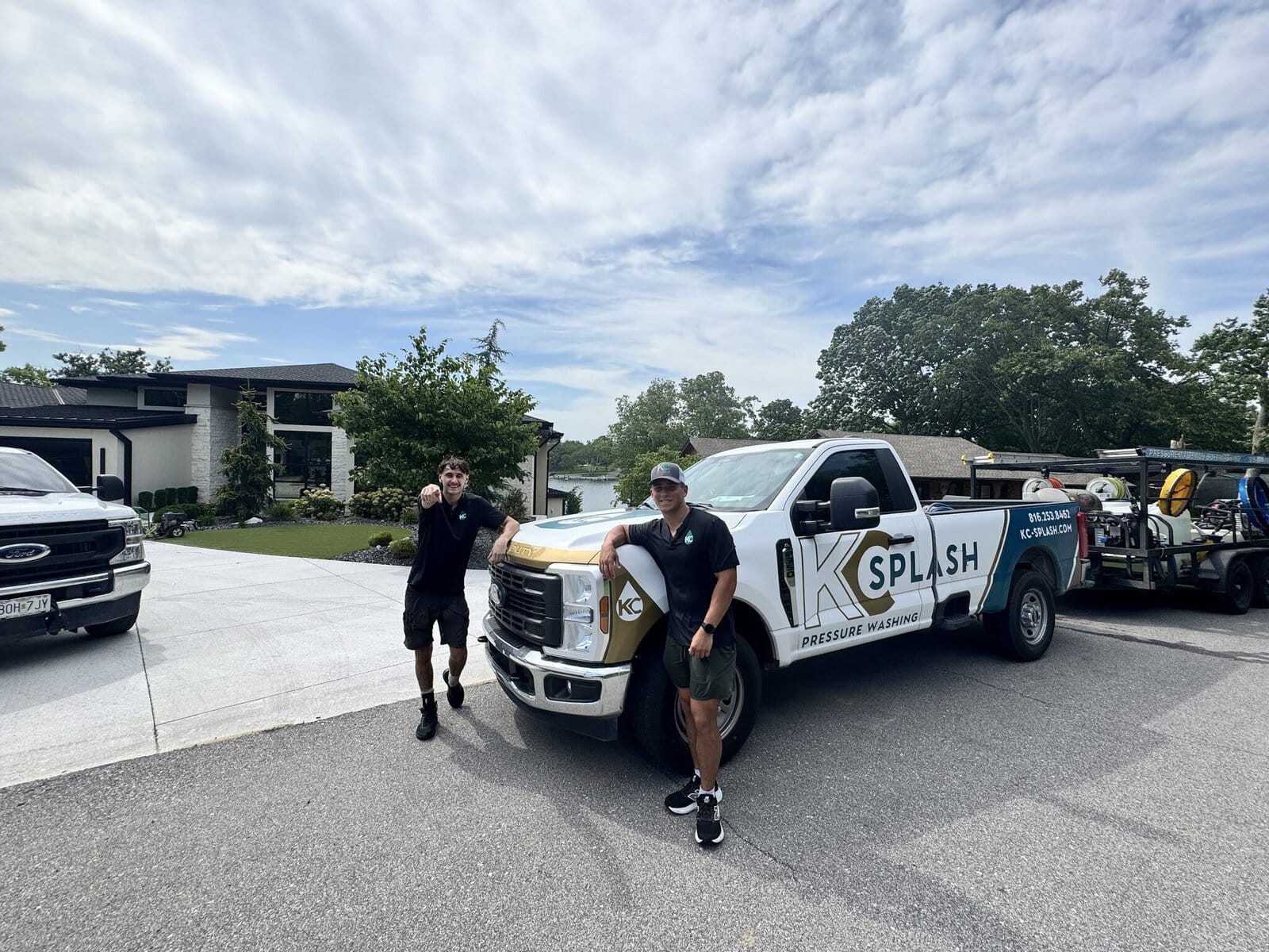 KC Splash crew and truck at a modern lakefront estate house washing job on Weatherby Lake