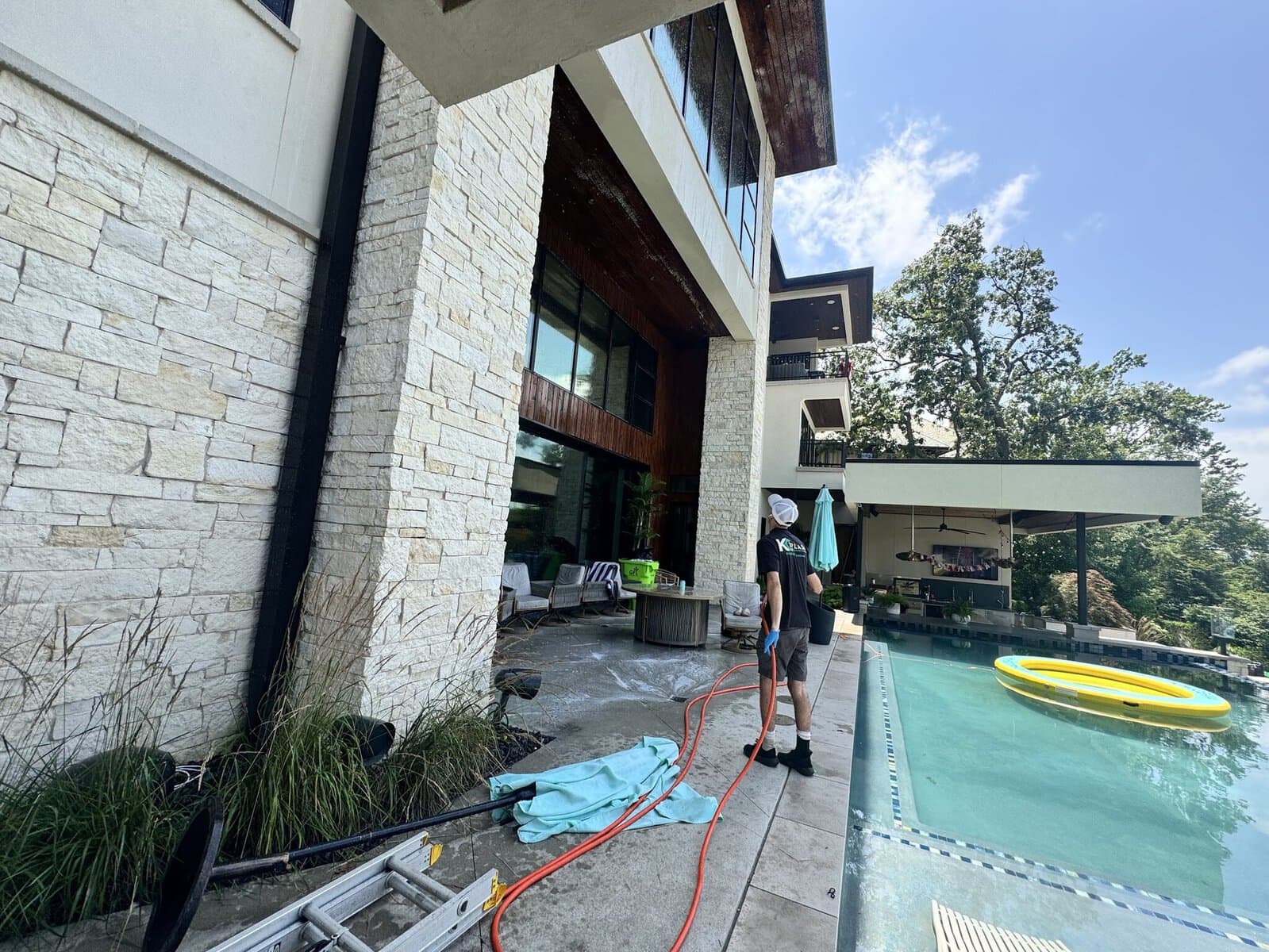 Soft washing a lakefront estate with the lake in view at Weatherby Lake in the Kansas City Northland
