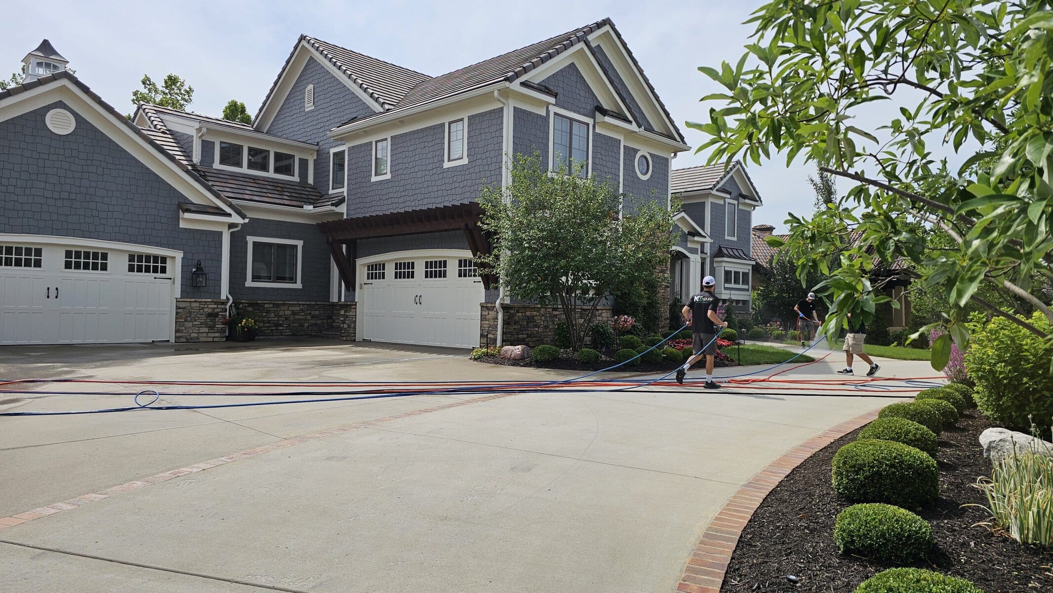 Front elevation of a luxury shingle-style estate in Kansas City's Northland before KC Splash soft wash