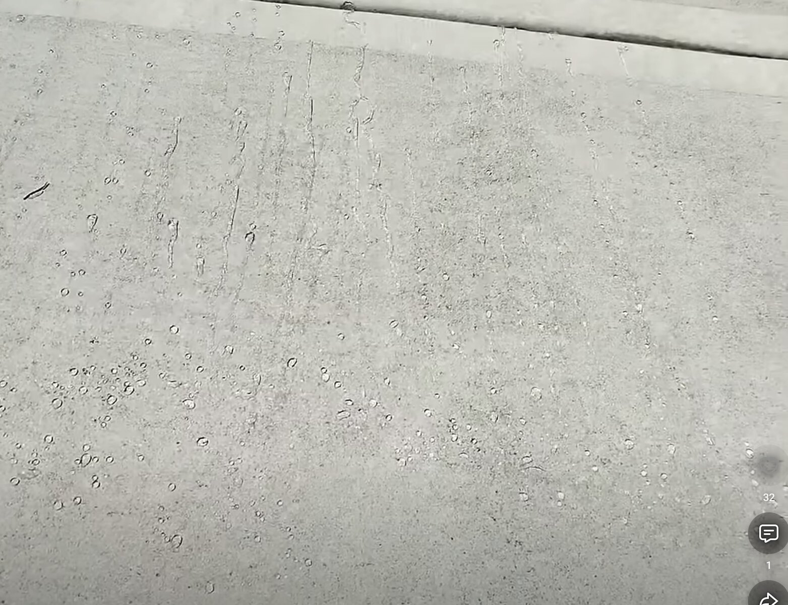 Water beading on freshly sealed concrete in Kansas City